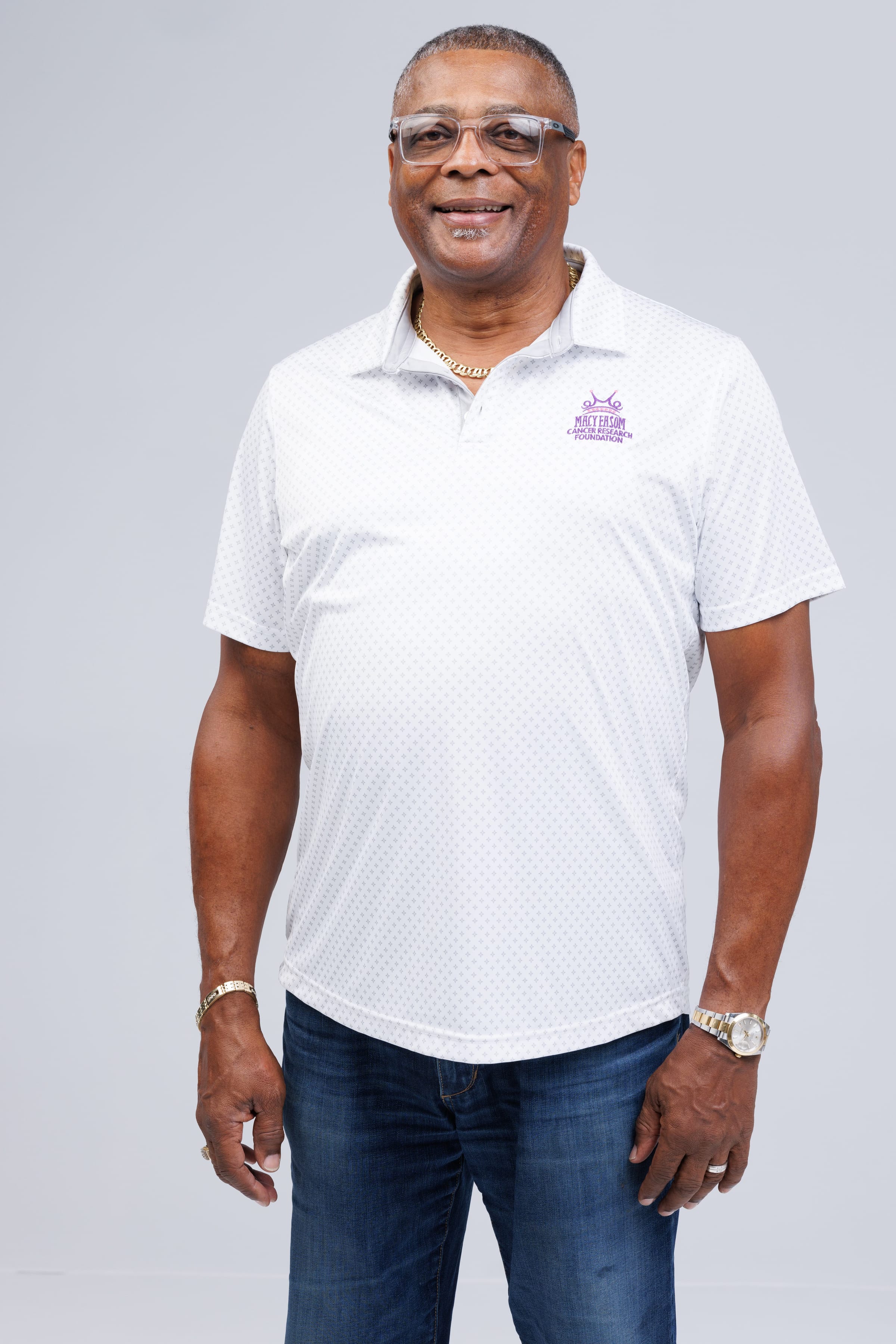 Dennis Dabney smiling in a white polo shirt